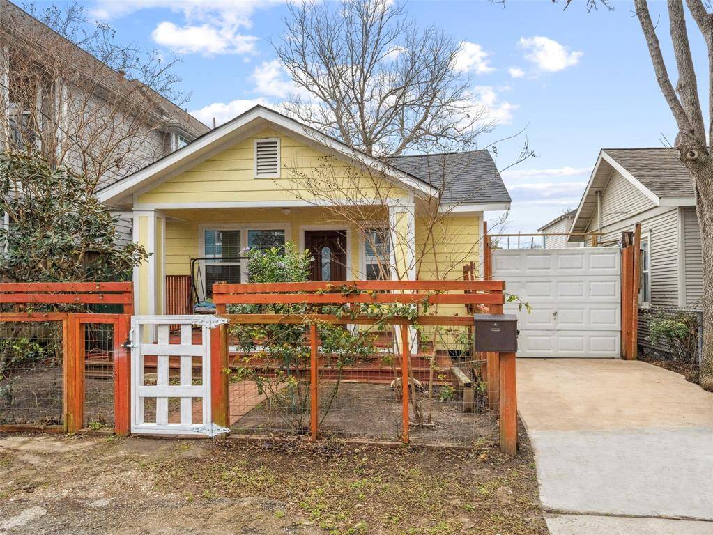 A welcoming A-frame front porch with a cozy swing, perfect for relaxing.