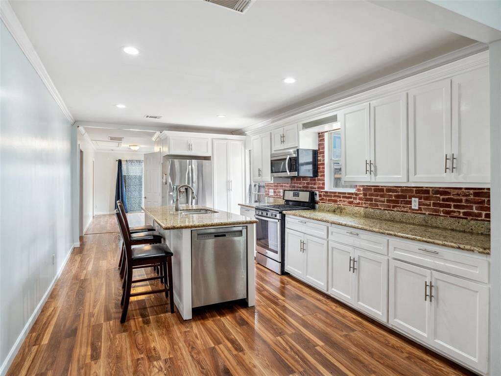 Plenty of room to gather around the kitchen island for meals and conversation.