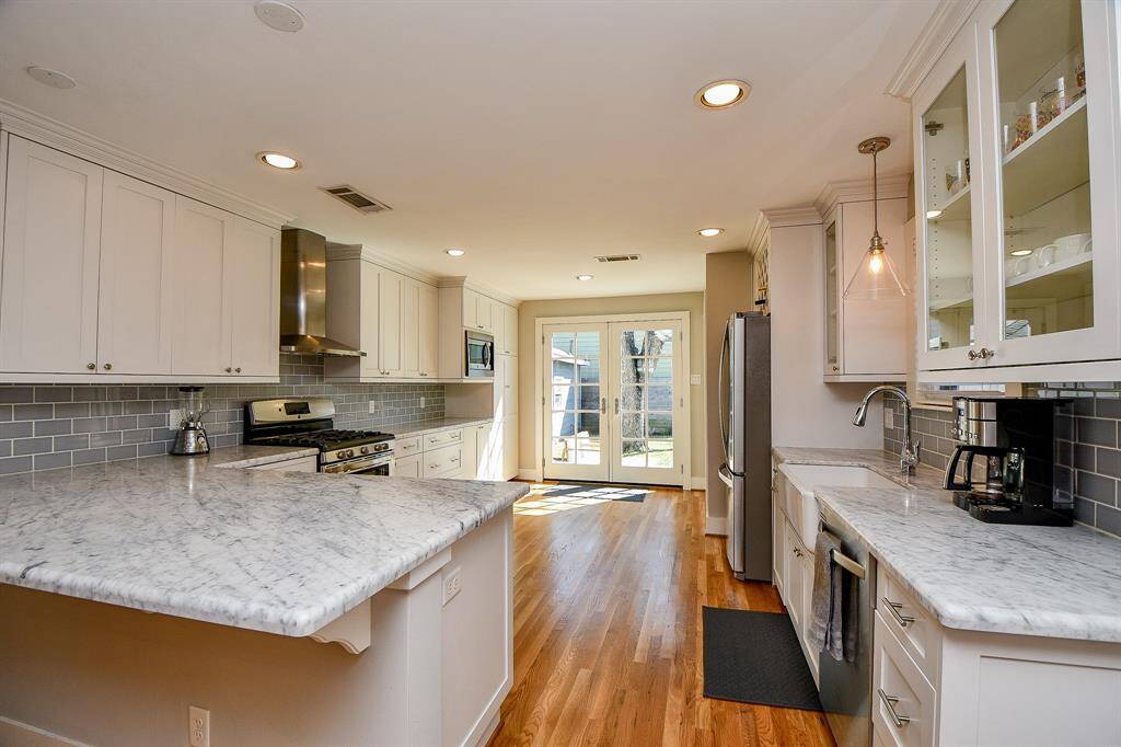 The kitchen has beautiful marble countertops.