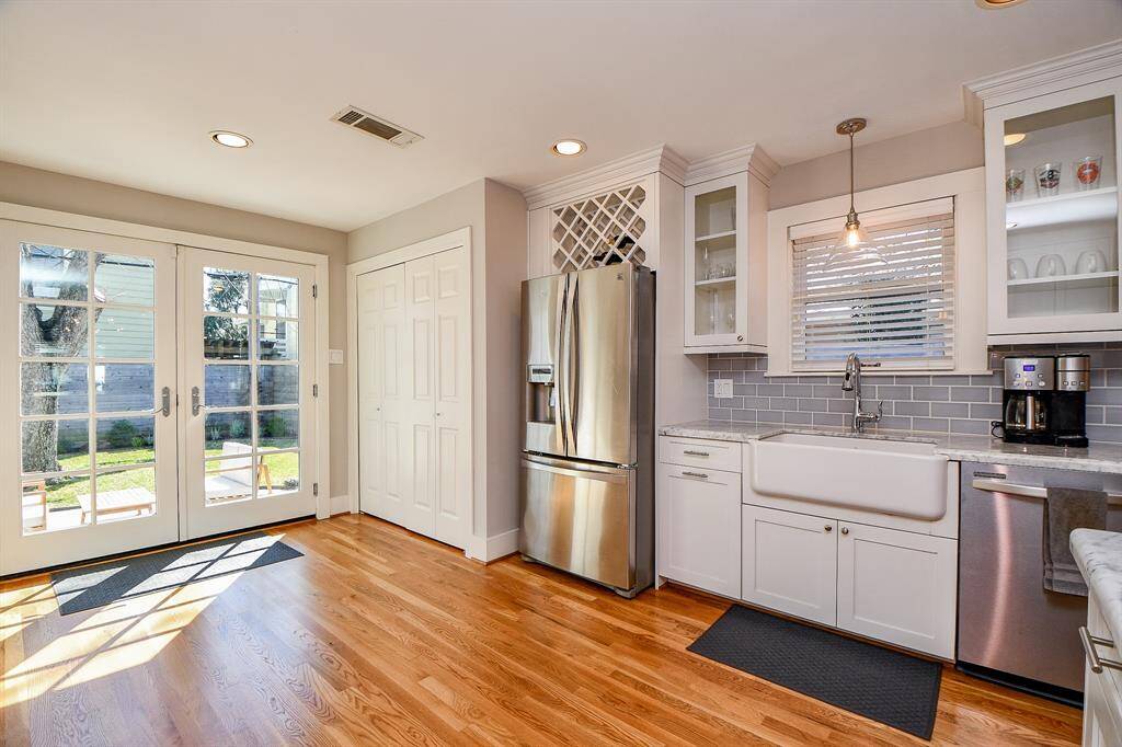 The washer and dryer are behind the double doors.