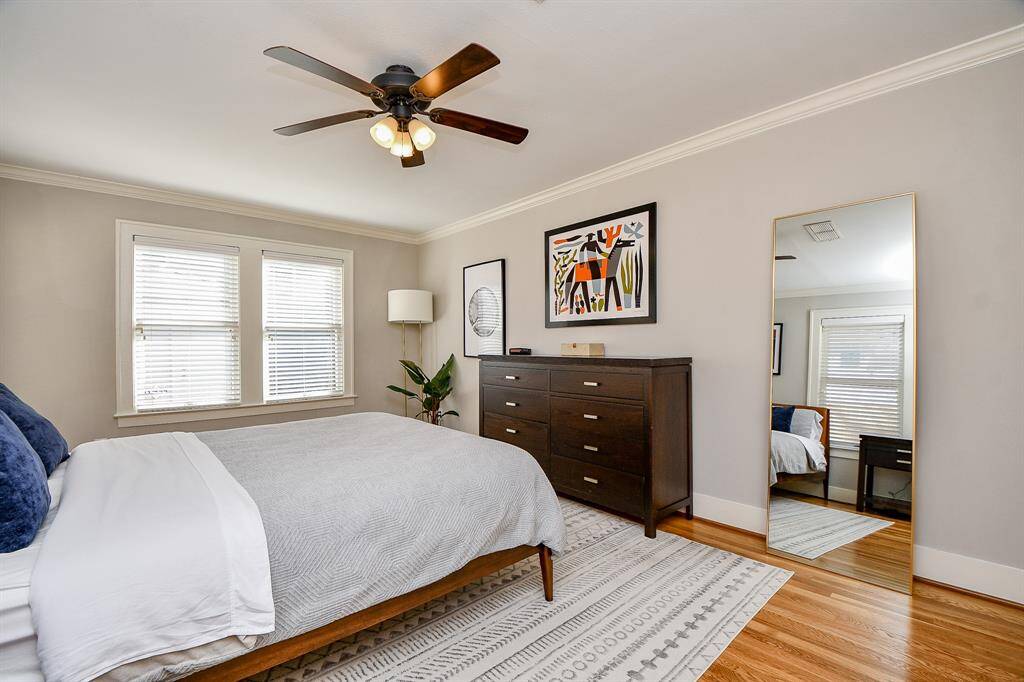 Another view of the primary bedroom with neutral colors.