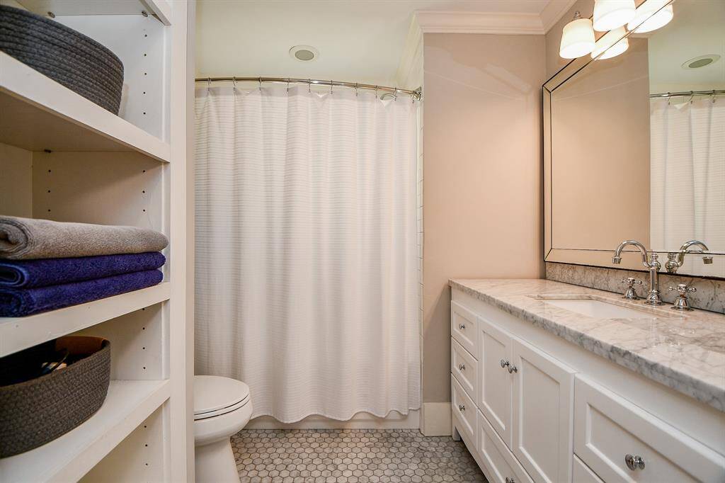 The bathroom has a nice vanity and a tub/shower. Plenty of storage.