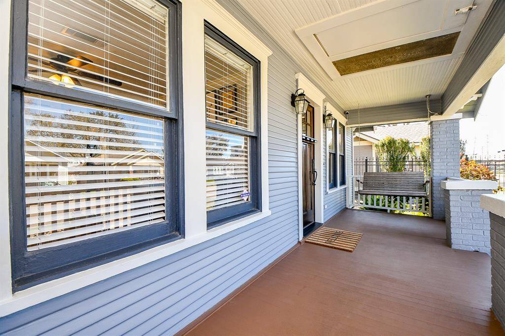 Enter the home through the front porch.