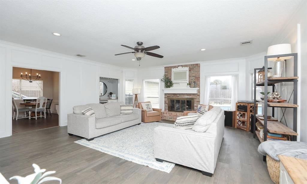 Wood-look floors and neutral paint create a warm and inviting atmosphere.