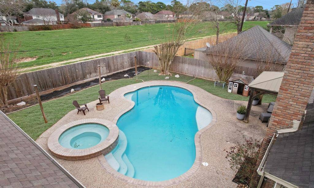 The yard backs onto a green space, offering added privacy, relaxation, and entertaining.