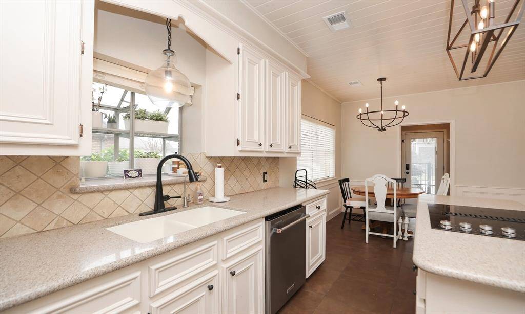 Modern fixtures throughout this terrific kitchen and a cozy breakfast area.