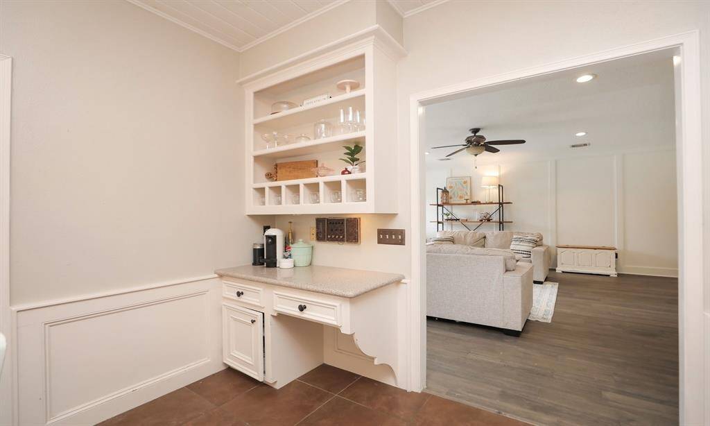 The breakfast room showcases a bright home office space.