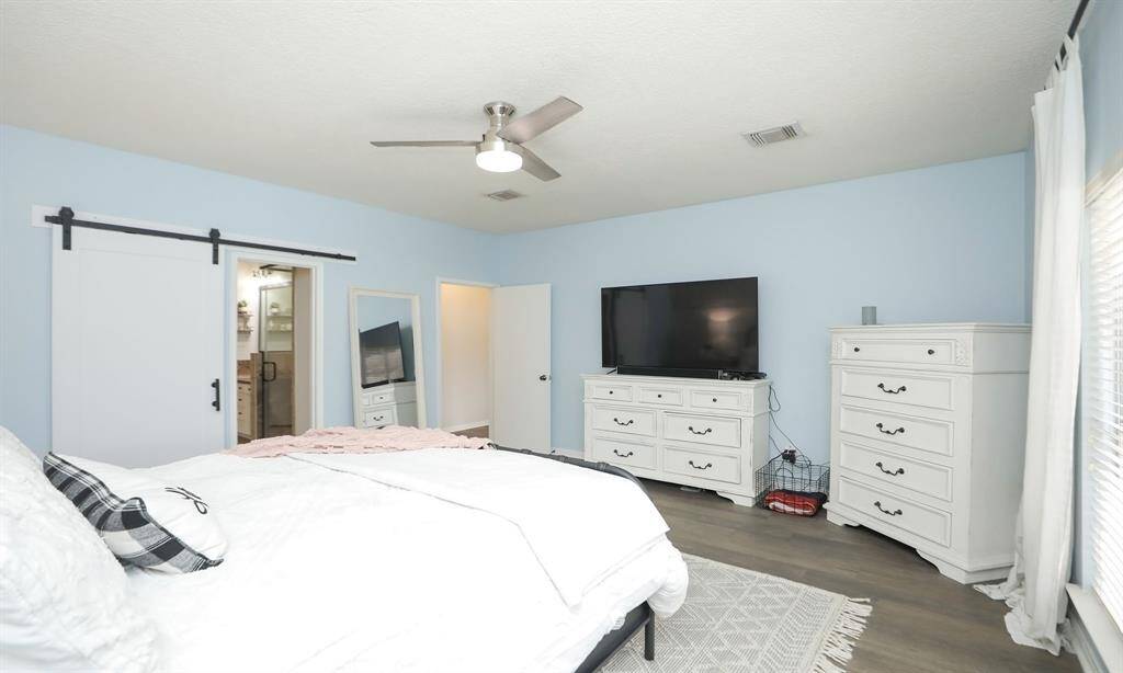 The room has a modern, airy feel with ample natural light.