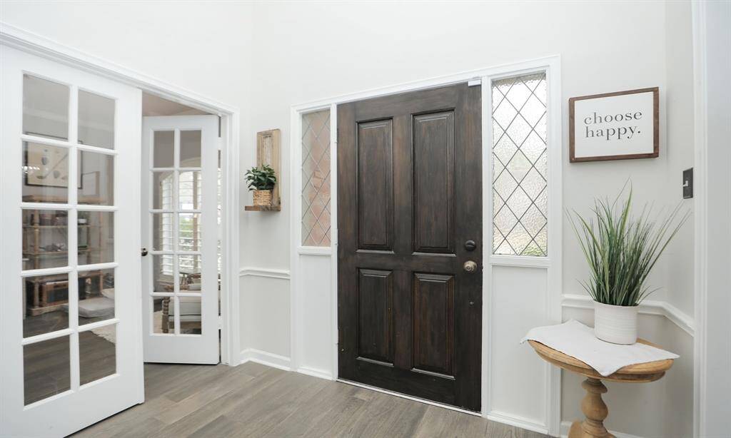 This entryway includes French doors leading into the study.