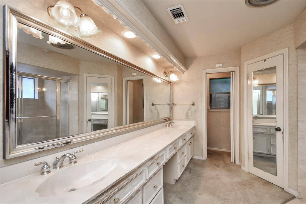 Primary bath has excellent lighting, dual sinks, separate closets, enclosed toilet and more....