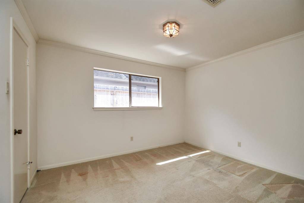 Guest bedroom features walk in closet. This room overlooks the West side of the property.
