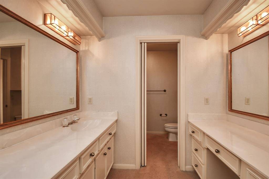 Guest bath has double vanities so there is plenty of room for everyone to get ready for their day.
