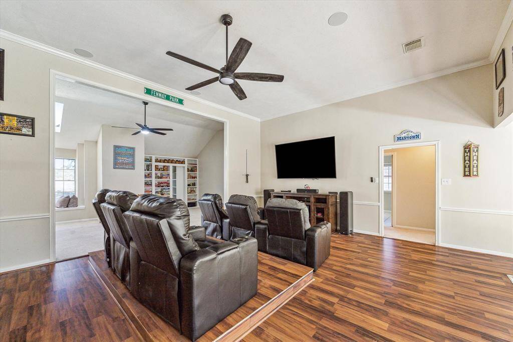 The open layout seamlessly connects to the game room, while also providing easy access to the surrounding bedrooms.  Notice the ceiling speakers for your entertainment enjoyment!