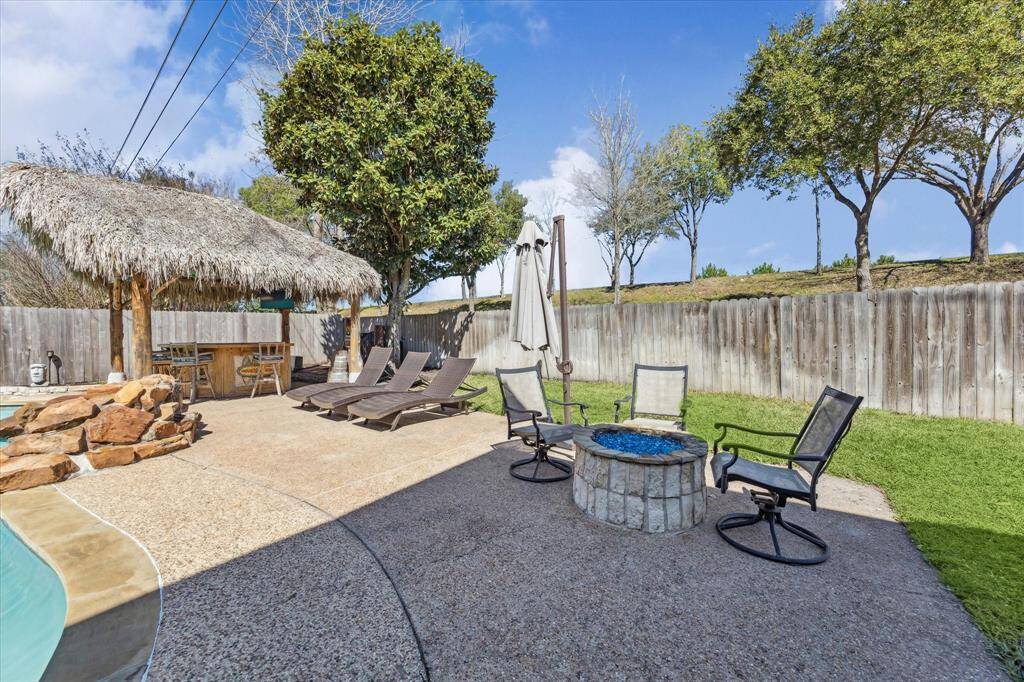 This beautifully designed backyard offers a serene escape with ultimate privacy, thanks to no back neighbors. Lounge in the sun on the extended patio, or gather around the stunning gas stone fire pit for cozy evenings