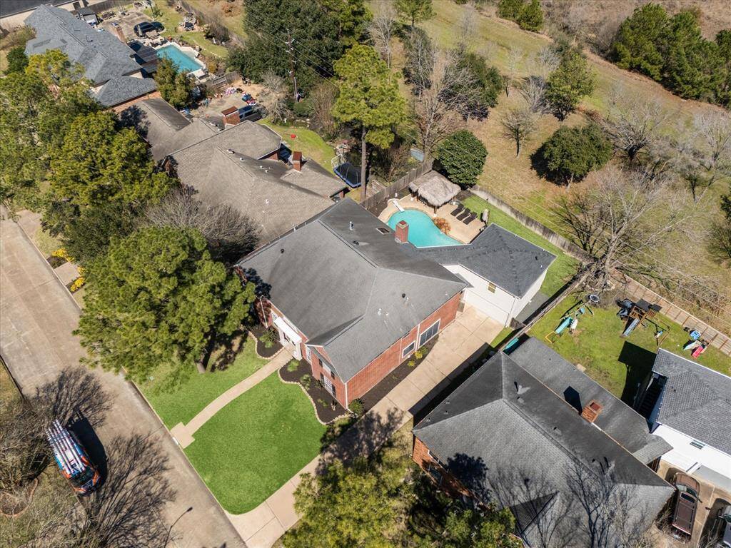 Aerial view of the property showing the green space behind the home. No Back Neighbors!