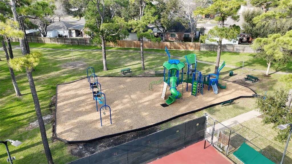 The community park has expansive greenspace for kids and furry friends to roam.