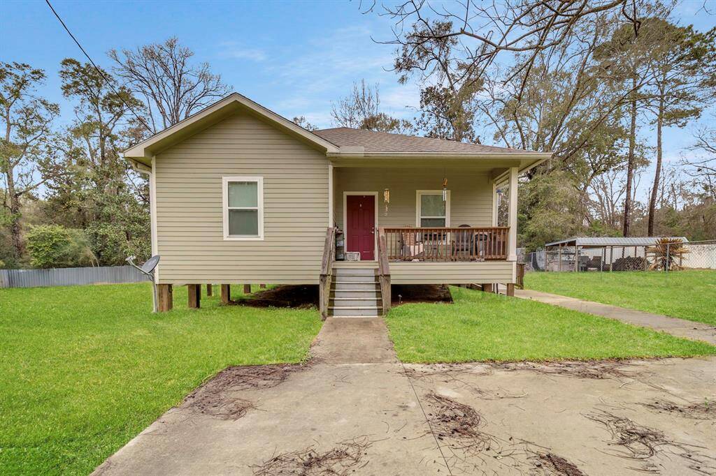 Discover this charming elevated home on a fully fenced lot, surrounded by mature trees. Enjoy ultimate privacy and comfort in a tranquil setting, complete with a welcoming front porch to unwind amidst nature.