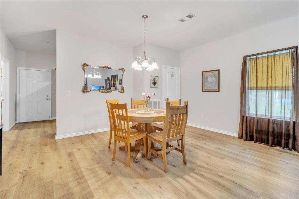 Charming dining area with convenient extra storage.