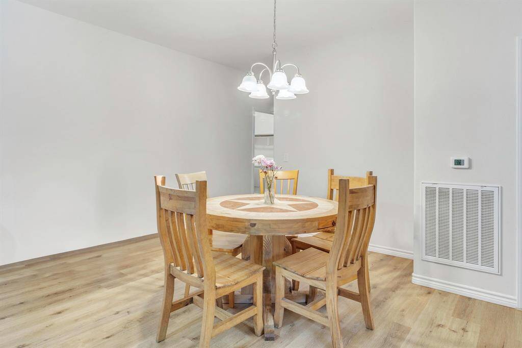 The kitchen is conveniently located adjacent to the dining area.
