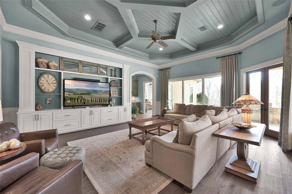 The guest suite is ideal for extended family, in-laws and friends! The suite features a large living area with accent ceiling, built-ins and multiple private exterior and garage entrances.