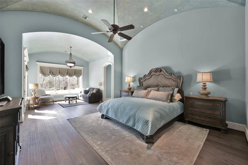 Step into the luxurious owner's suilte and be greeted by warm wood floors and private sitting area with incredible views.