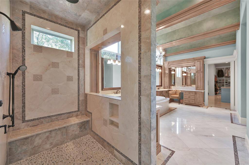 An oversized shower with multi-wall and rain faucet heads is the ultimate in relaxation!