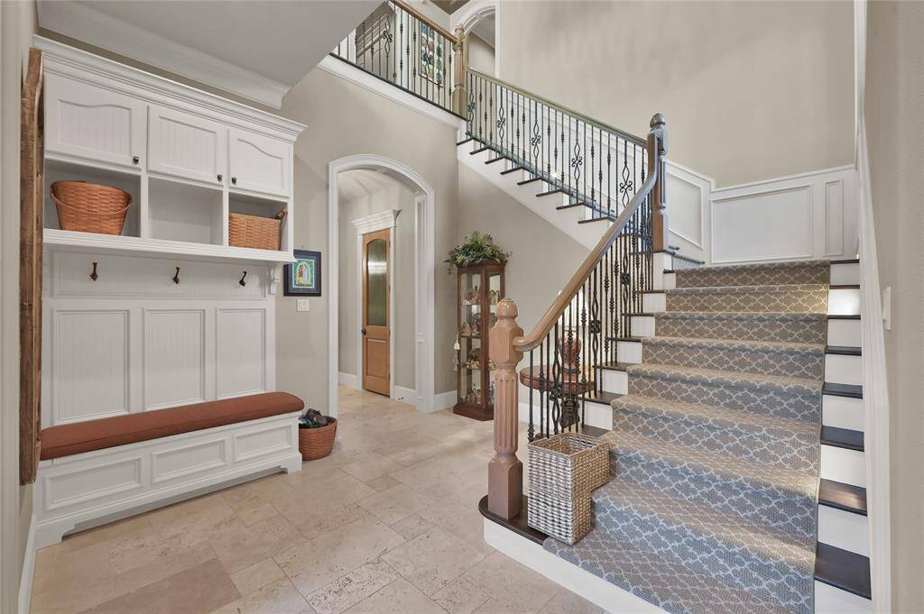 Just off the kitchen is a mud room with built-in hobby desk and stairs leading to the second floor.