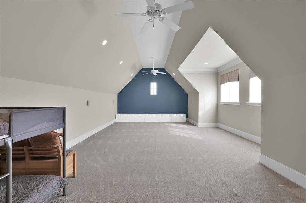 This finished flex space makes a perfect game room or media room!