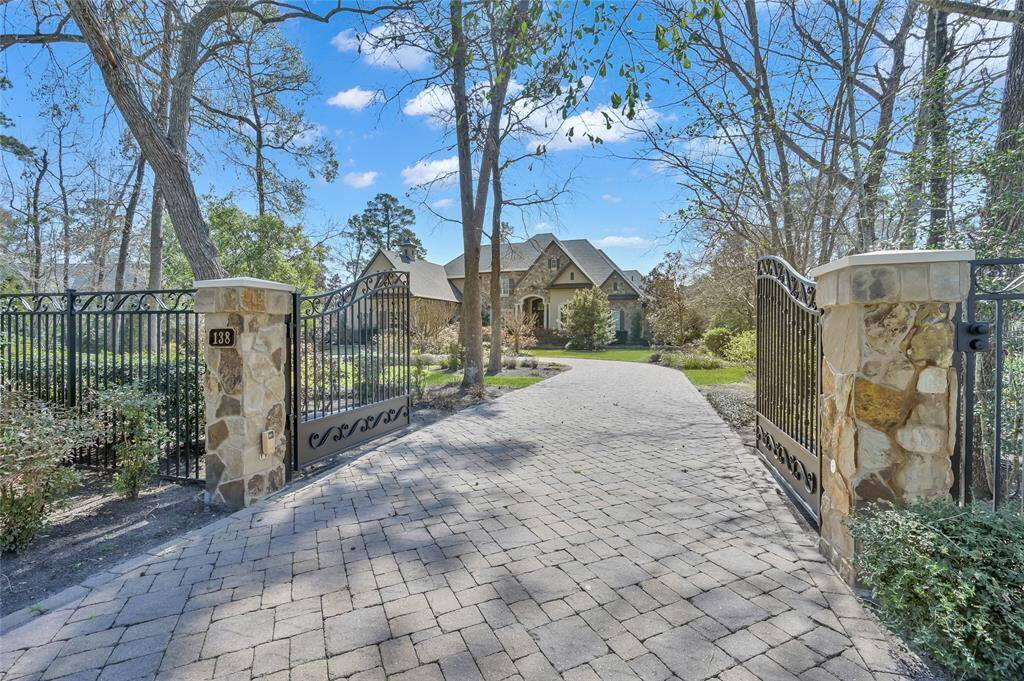A private gated circular driveway creates added safety and convenience.