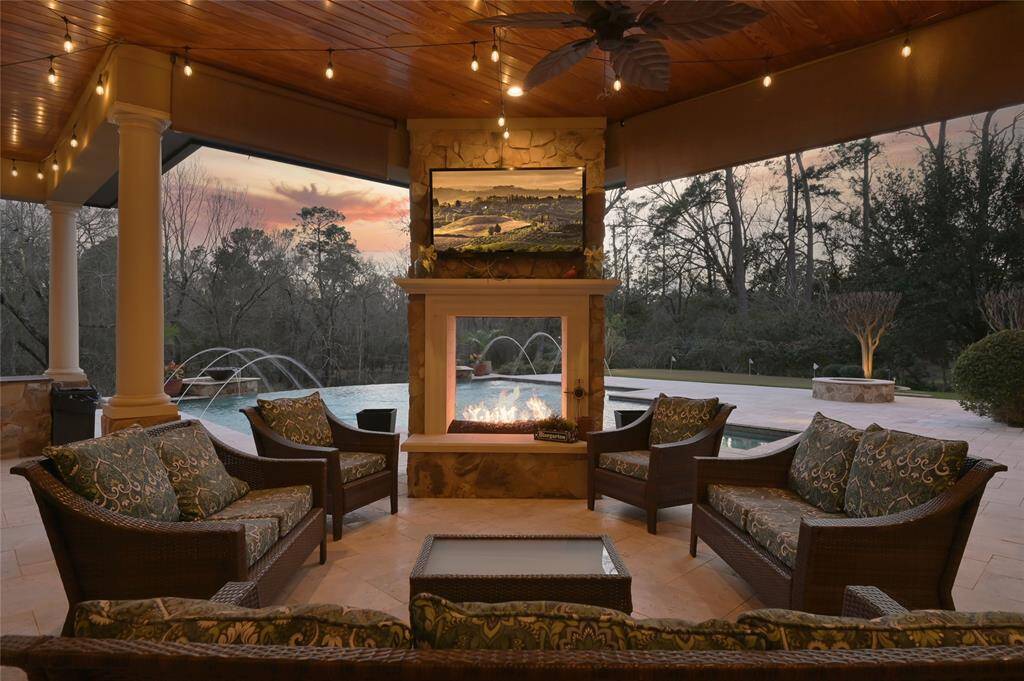 A double-sided, open gas-log fireplace creates a cozy space for enjoying family, friends and sunset views.