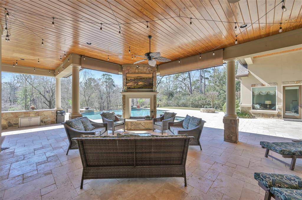 No detail is overlooked with wood accent ceilings, party lights and an outdoor tv.