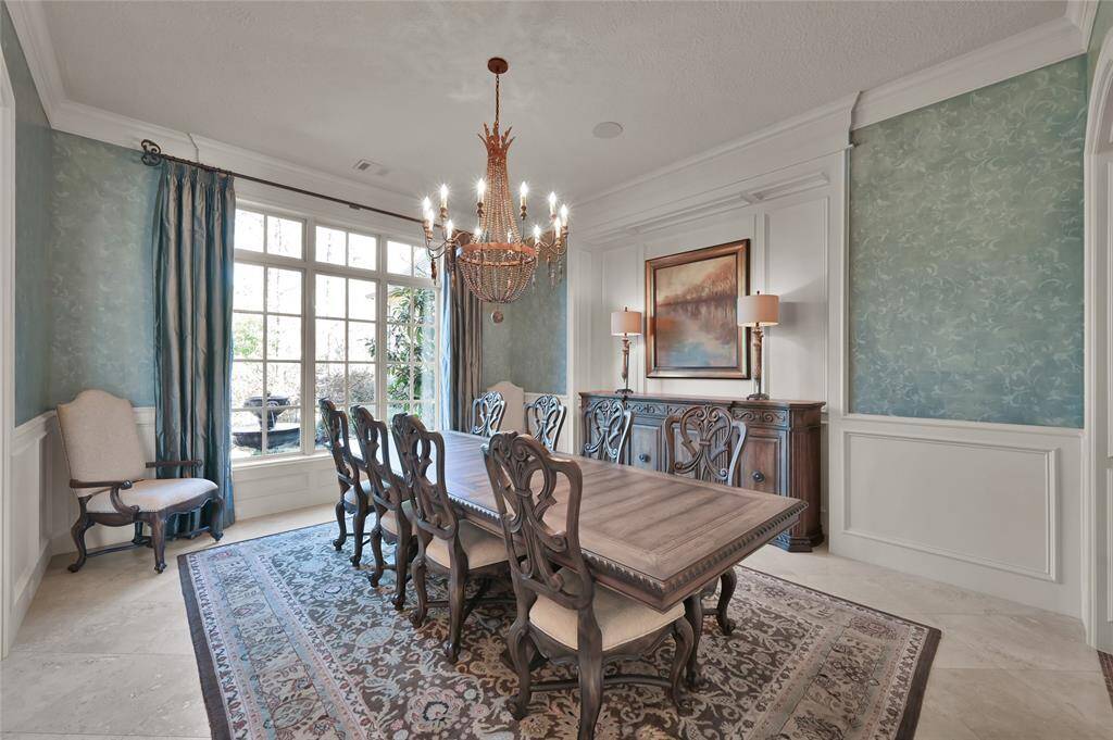 The formal dining room comfortably seats 10-12 guests.