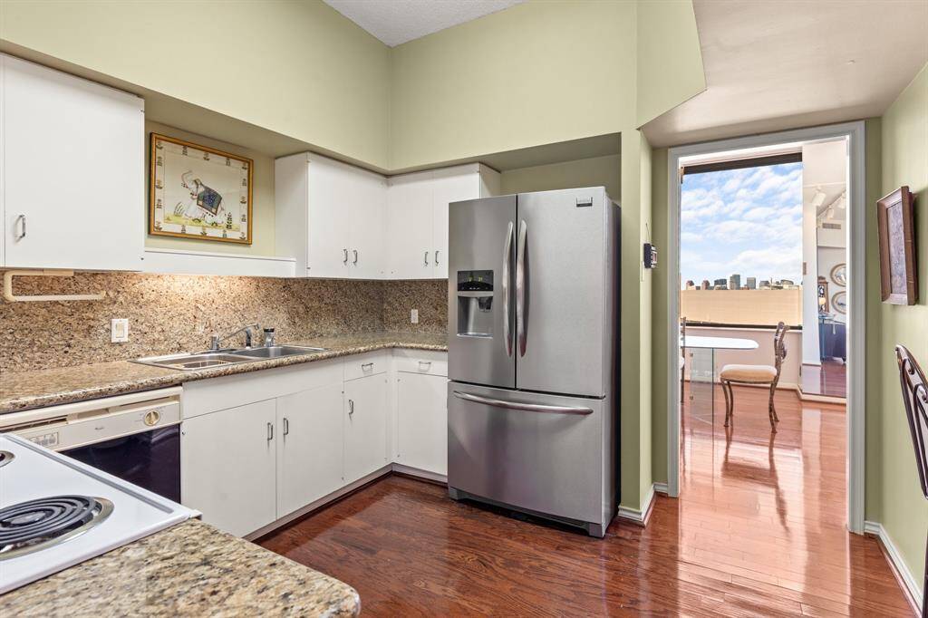 Kitchen with granite counters.
