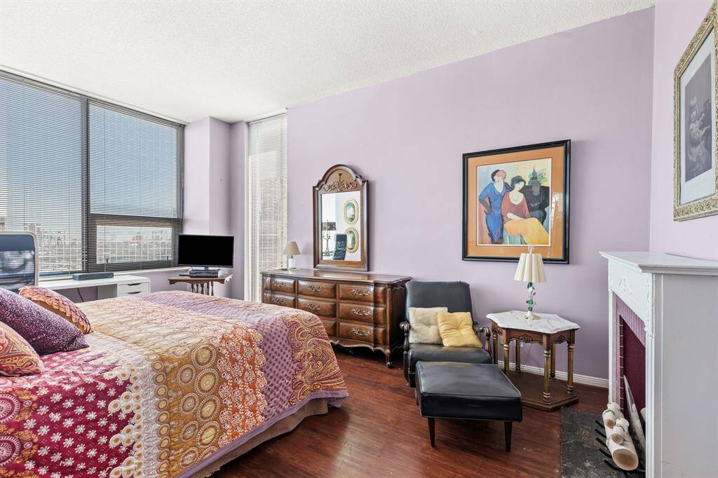 Primary bedroom with a walk-in closet and private bathroom.