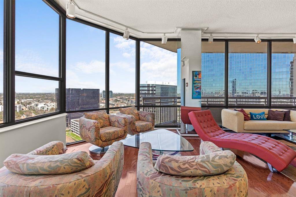 Living area with wonderful walls of windows and abundant natural light.