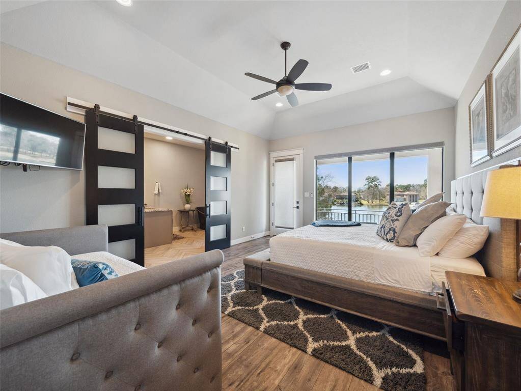 PRIMARY SUITE  Private Terrace overlooks the lake. Wall of glass for bedside water & sky views.