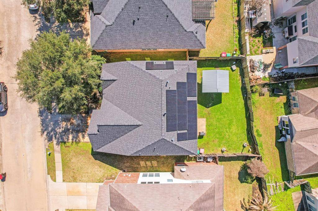 Aerial view of the home nestled on the lot