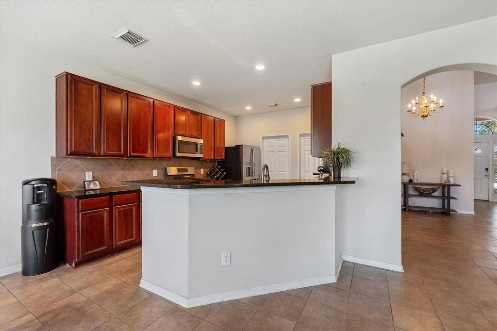 The breakfast bar allows for casual dining and additional seating.