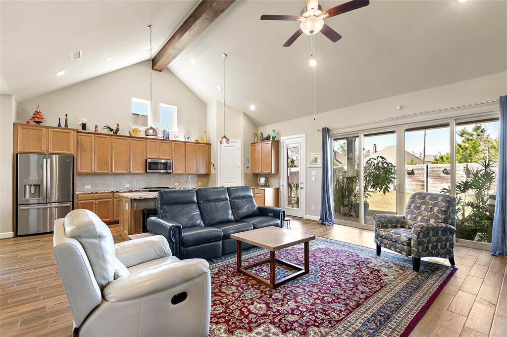 Large sliding glass doors open to views of the gorgeous backyard.