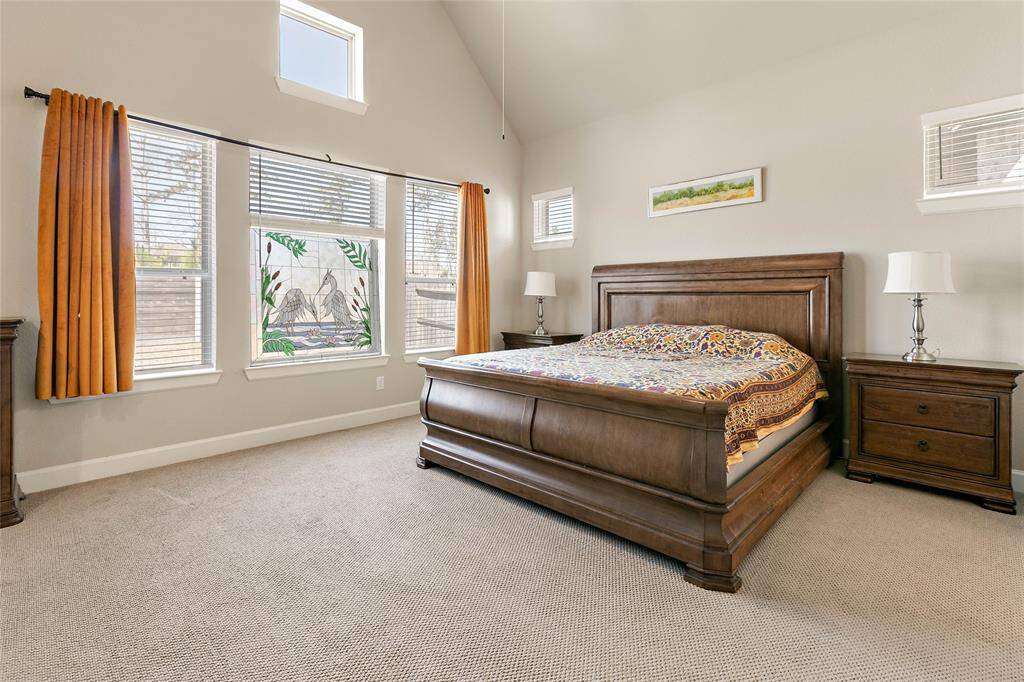 Your primary suite overlooks the back yard and comes complete with vaulted ceilings and an exposed beam on the ceiling.
