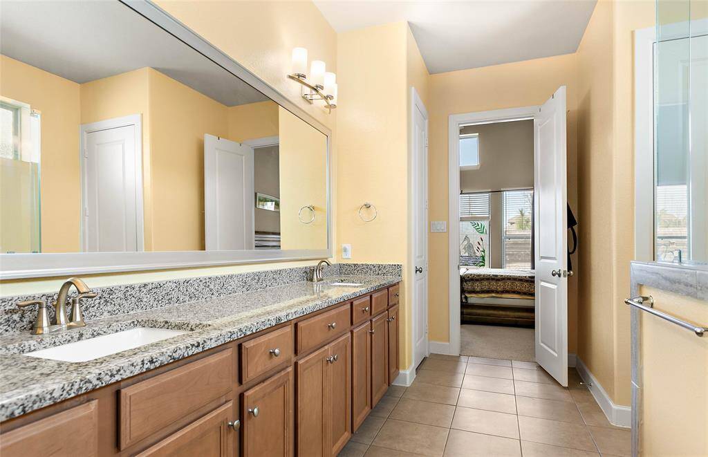 Ensuite bath of the primary bedroom with room for two.