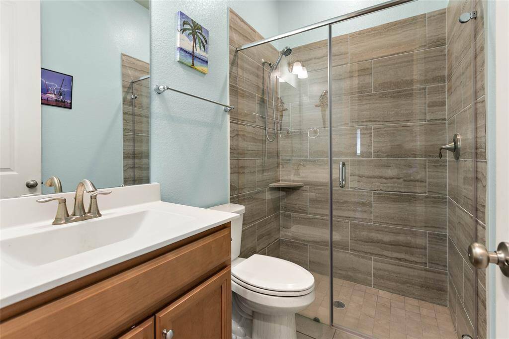 Third full bath with step in shower.