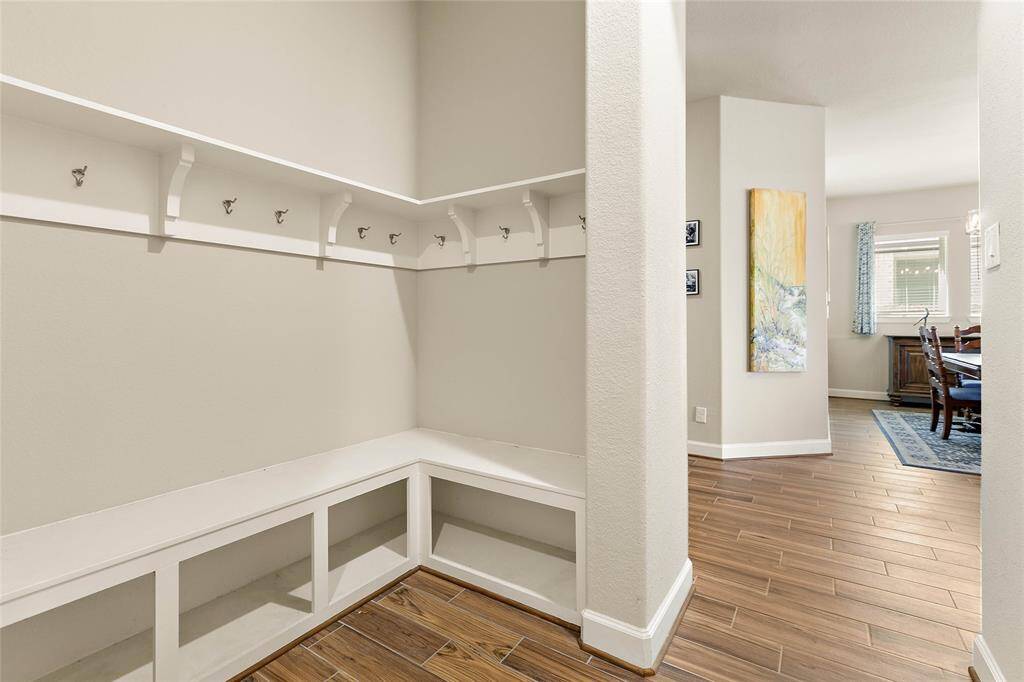 Backpack rack and storage area in mud room off garage, what a useful home feature!