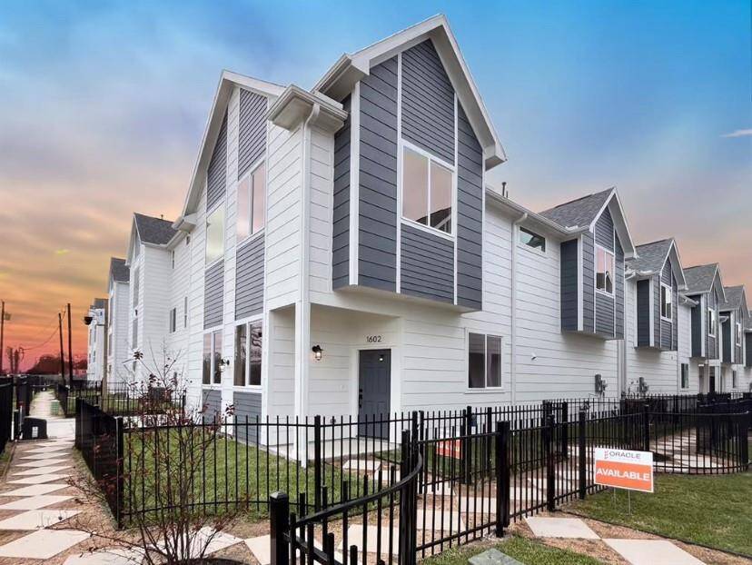Enjoy ample yard space, with convenient access to a two-car garage, shared driveway, and gated entry.