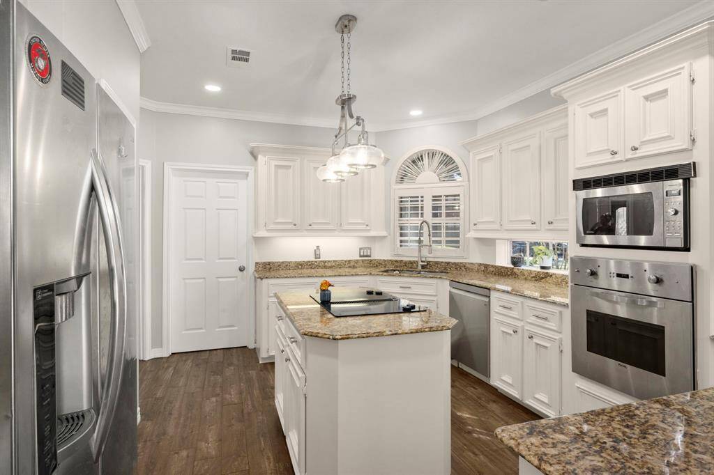 Laundry room is through the door to the back of the kitchen.