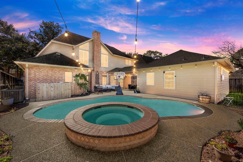 Backyard is ready for summer evenings of family swimming and BBQ's.