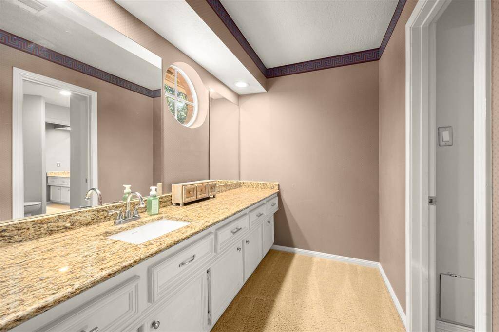 Bath 2 Jack-n-Jill -  Accessible from Bedroom 3. Tons of counter space, granite tops, under-mount sink and a window for natural light while getting ready.