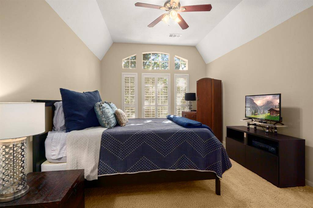 Bedrom 4 - Vaulted ceilings, carpet, shutters, ceiling fan, neutral paint, walk-in closet and accessible to Bath 3 (also a Jack-n-Jill bath).