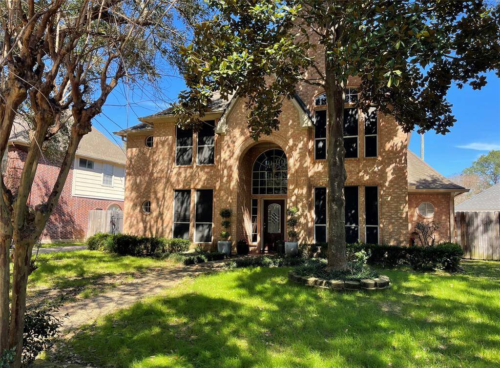 Curb appeal will "WOW!" you from this Spring, Texas home sitting on the beautifully wooded street of Winchmore Hill.
