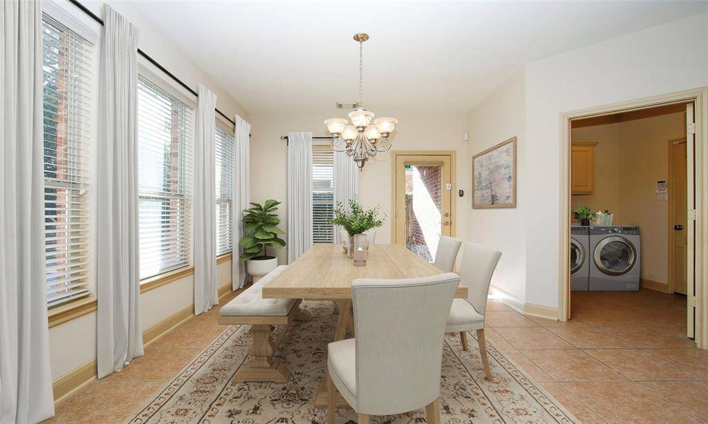 Breakfast nook with access door to backyard and covred patio